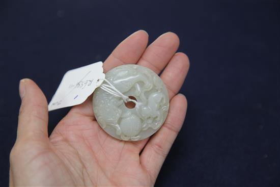 A Chinese pale celadon bi disc, 19th century, diameter 5.1cm
